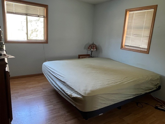 24314 South Burr Road Channahon, IL 60410 - Photo 12 of 17 a bed sitting in a bedroom next to a window