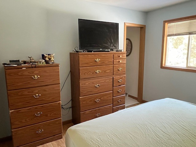 24314 South Burr Road Channahon, IL 60410 - Photo 13 of 17 a bedroom with a bed and a flat screen tv