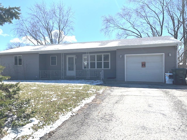 24314 South Burr Road Channahon, IL 60410 - Photo 2 of 17 a front view of a house with a yard and garage