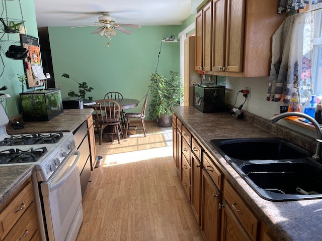 24314 South Burr Road Channahon, IL 60410 - Photo 8 of 17 a kitchen with stainless steel appliances granite countertop a stove a sink and a microwave