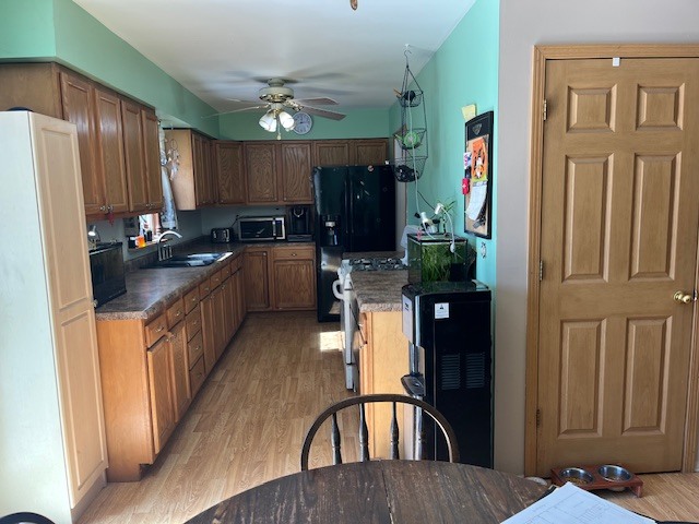 24314 South Burr Road Channahon, IL 60410 - Photo 10 of 17 a kitchen with stainless steel appliances granite countertop a refrigerator a stove top oven and sink