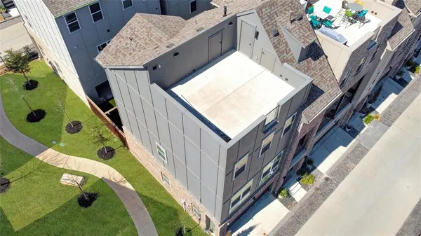 an aerial view of a house with a swimming pool