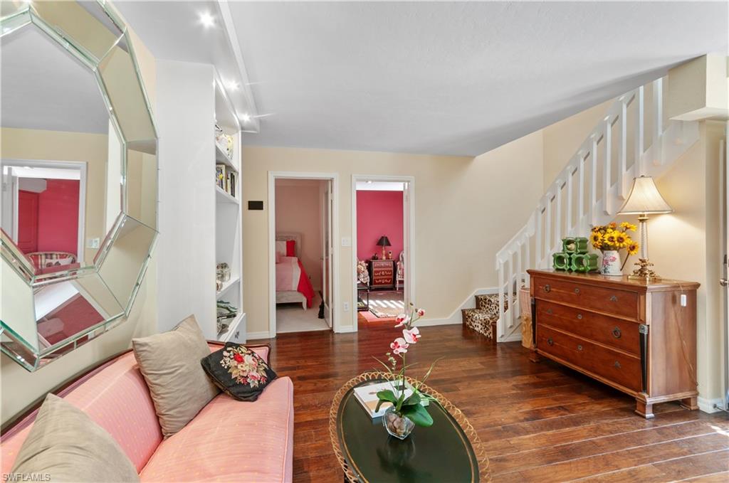 1313 Solana Road, Unit A3 Naples, FL 34103 - Photo 7 of 29 Living room featuring stairs and dark wood finished floors