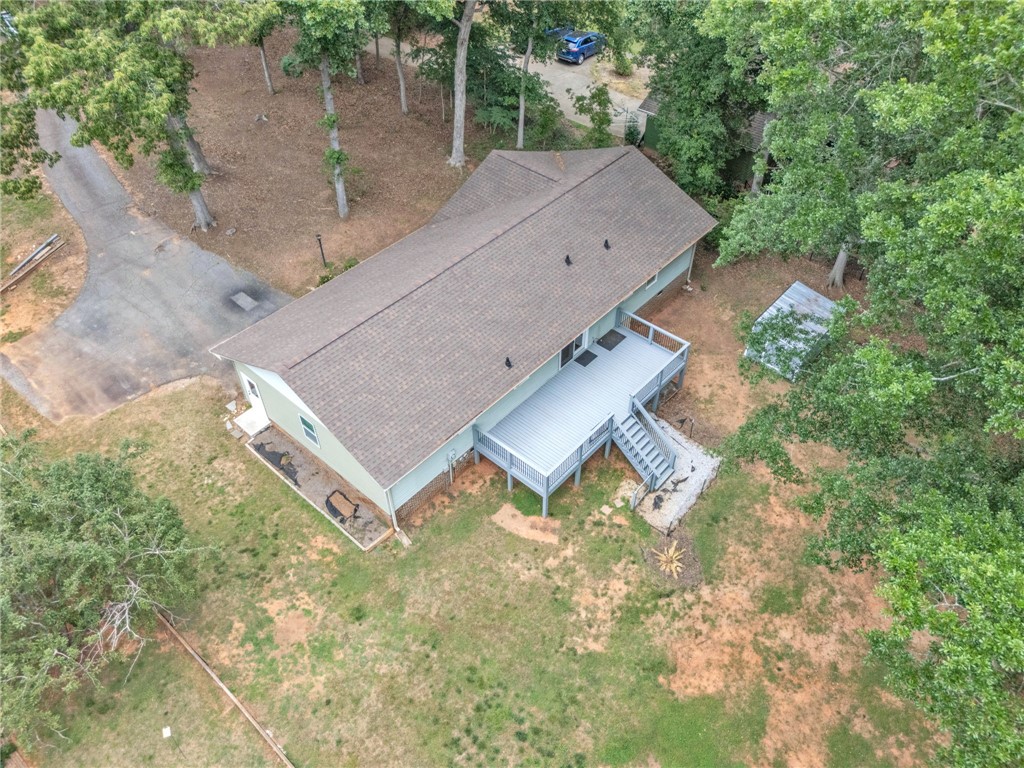 4416 Denver Cove Road Anderson, SC 29625 - Photo 26 of 31 An aerial perspective showcases the inviting outdoor deck and a sweeping view of the surrounding trees.