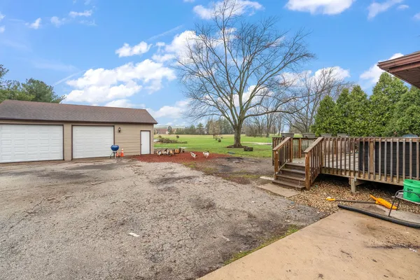 a view of a house with a patio and wooden flooring