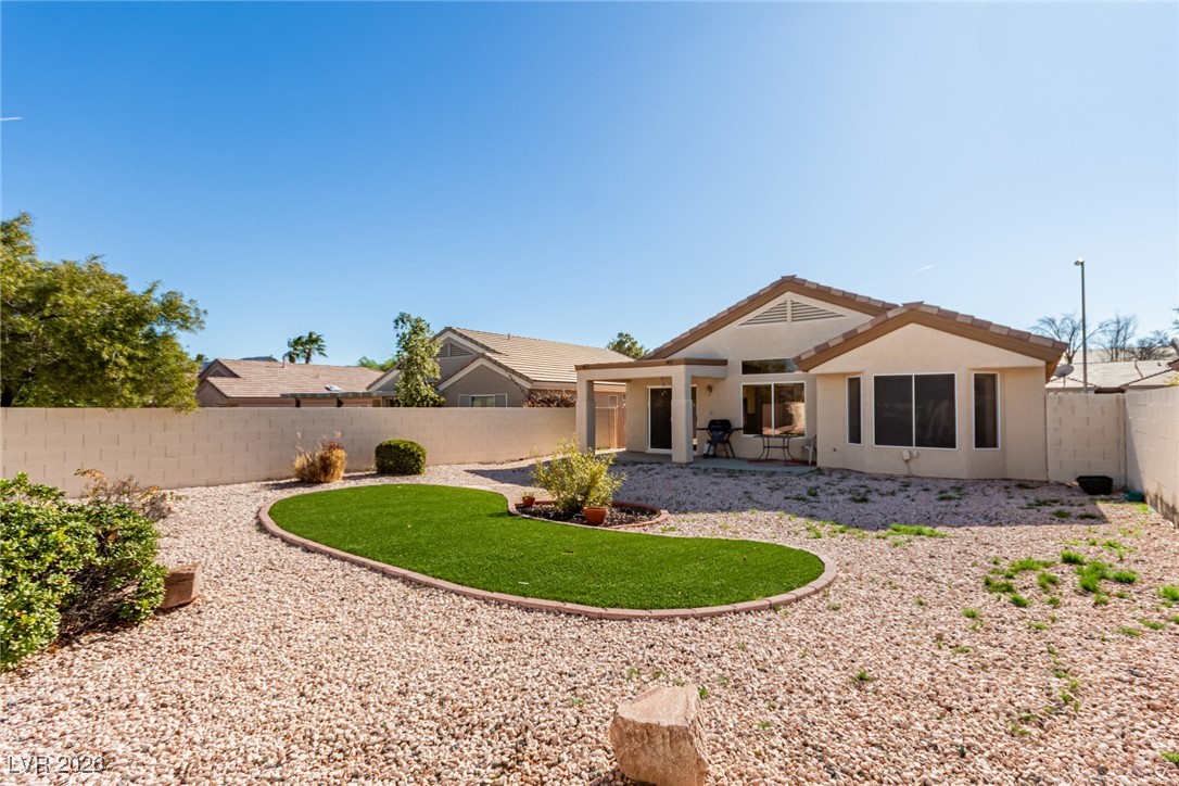 2148 Point Mallard Drive Henderson, NV 89012 - Photo 2 of 31 Rear view of house featuring a patio area, a fenced backyard, and stucco siding