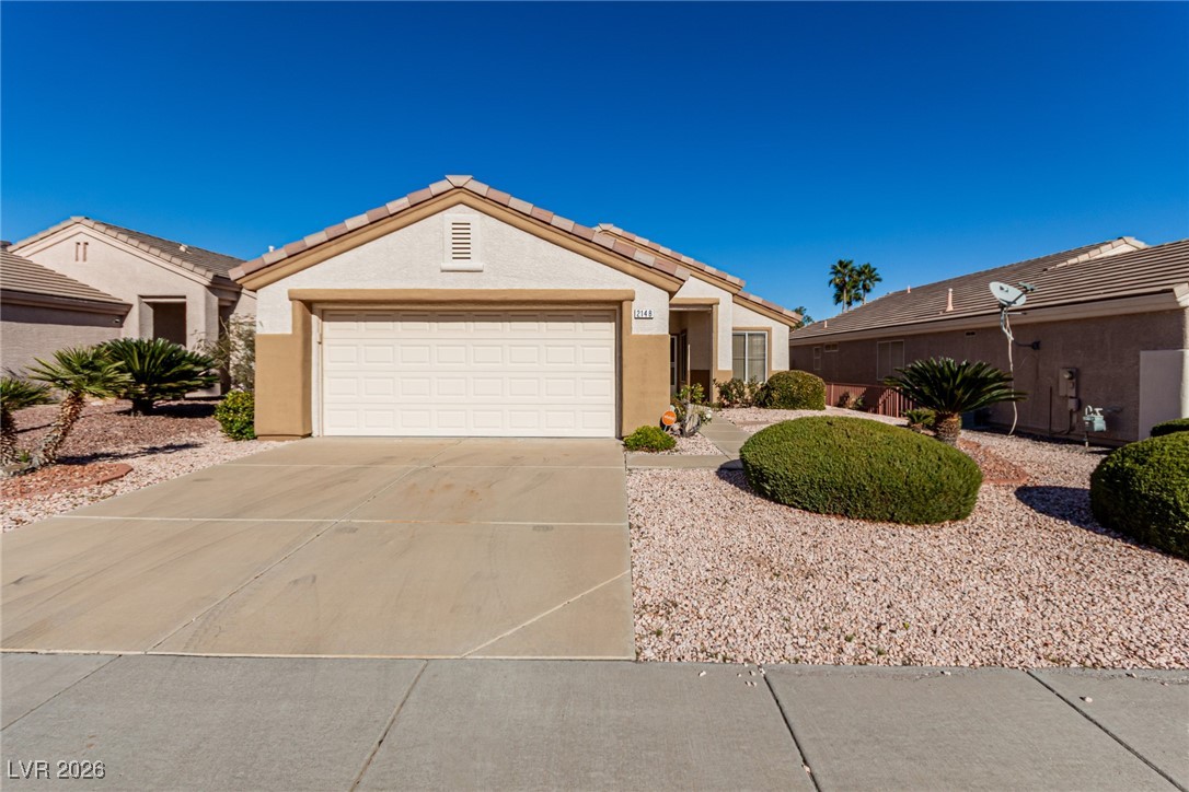 2148 Point Mallard Drive Henderson, NV 89012 - Photo 31 of 31 Ranch-style house with stucco siding, driveway, a garage, and a tile roof