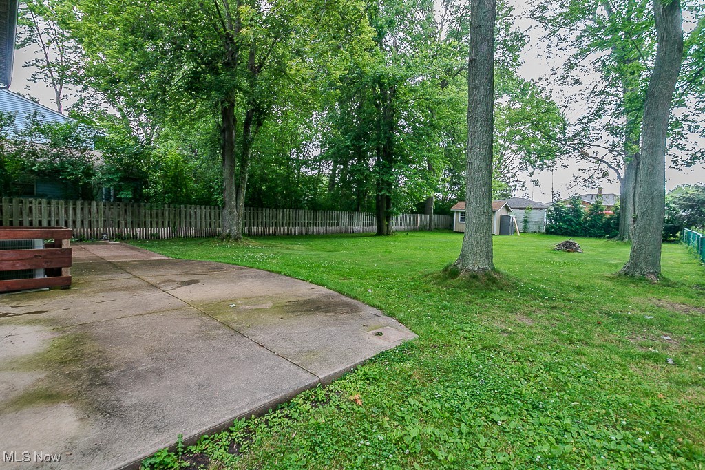 2969 Gale Road Willoughby, OH 44094 - Photo 46 of 46 Fenced backyard featuring a patio area and a storage unit