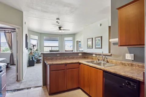 a kitchen with a sink and a refrigerator