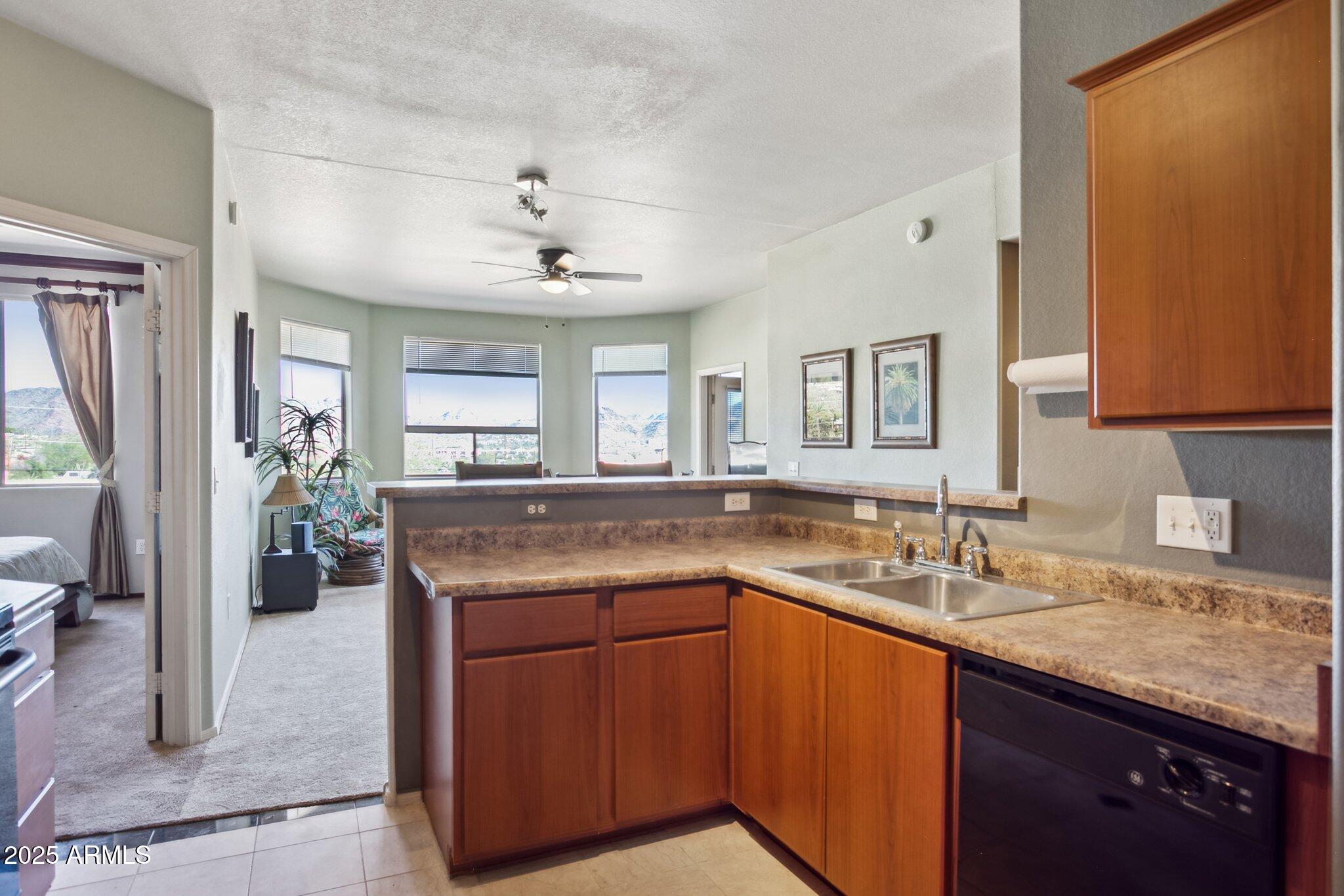 a kitchen with a sink and a refrigerator