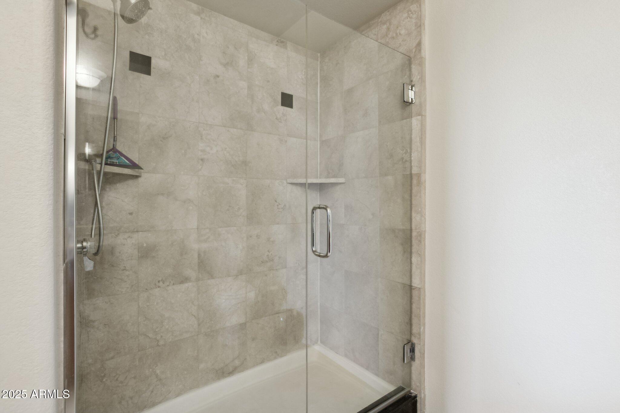 9820 North Central Avenue, Unit 317 Phoenix, AZ 85020 - Photo 13 of 26 a bathroom with a shower
