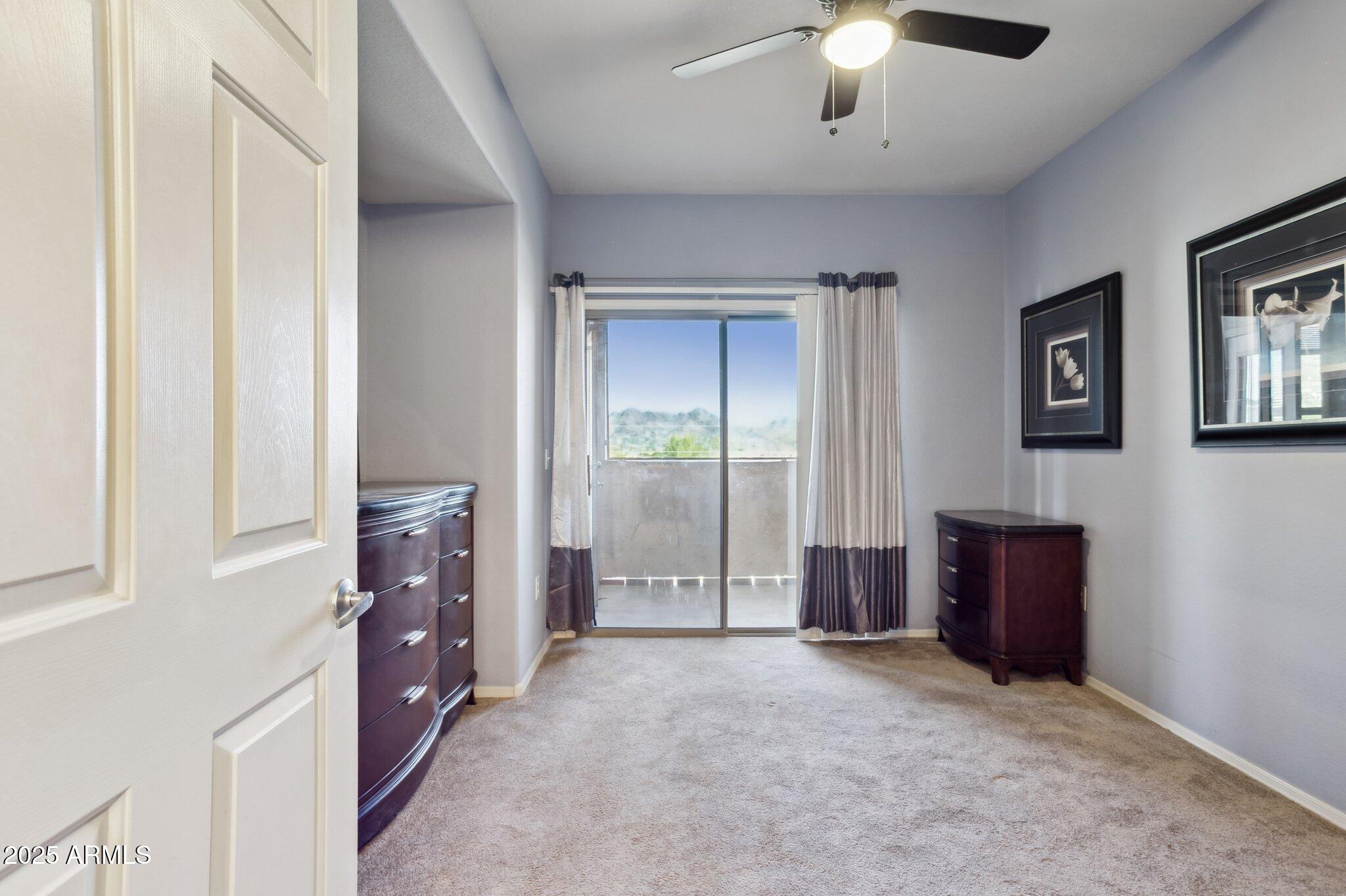 9820 North Central Avenue, Unit 317 Phoenix, AZ 85020 - Photo 14 of 26 an empty room with windows and cabinet
