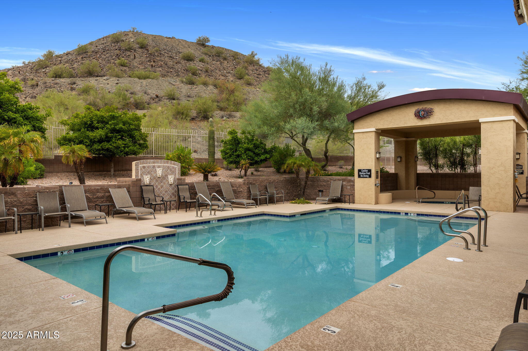 9820 North Central Avenue, Unit 317 Phoenix, AZ 85020 - Photo 21 of 26 a view of a patio with chairs and table