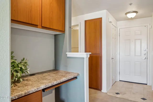 a view of kitchen with cabinets