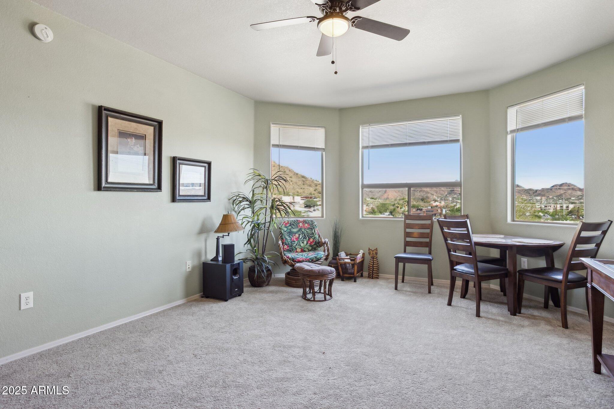 9820 North Central Avenue, Unit 317 Phoenix, AZ 85020 - Photo 6 of 26 a view of a livingroom with furniture and a window