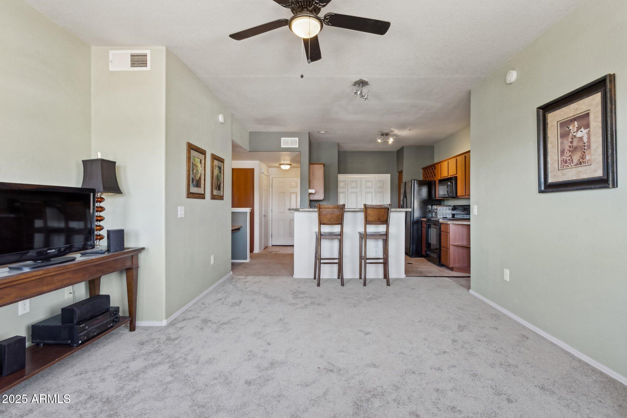 9820 North Central Avenue, Unit 317 Phoenix, AZ 85020 - Photo 7 of 26 a view of kitchen with furniture and a ceiling fan