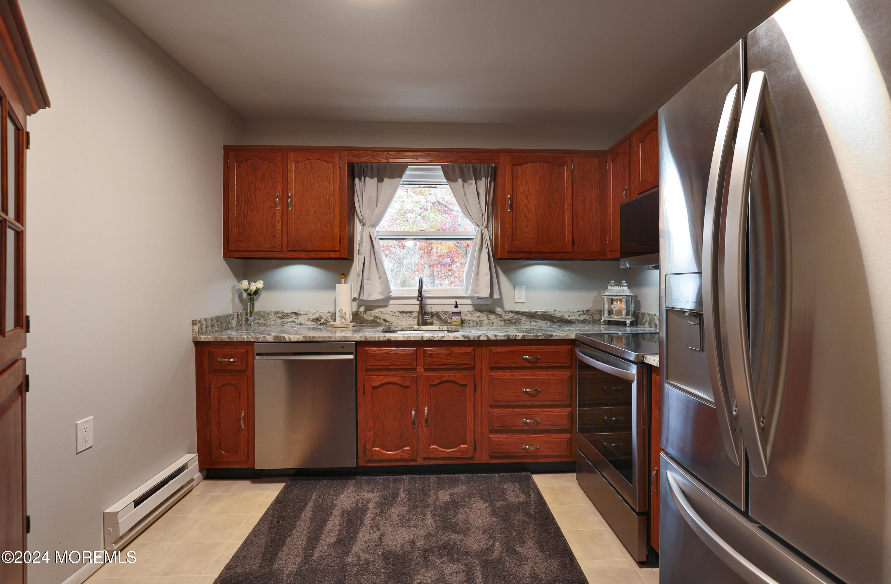 20 Cranberry Road, Unit 8 Manahawkin, NJ 08050 - Photo 17 of 42 a kitchen with stainless steel appliances granite countertop a refrigerator and a sink