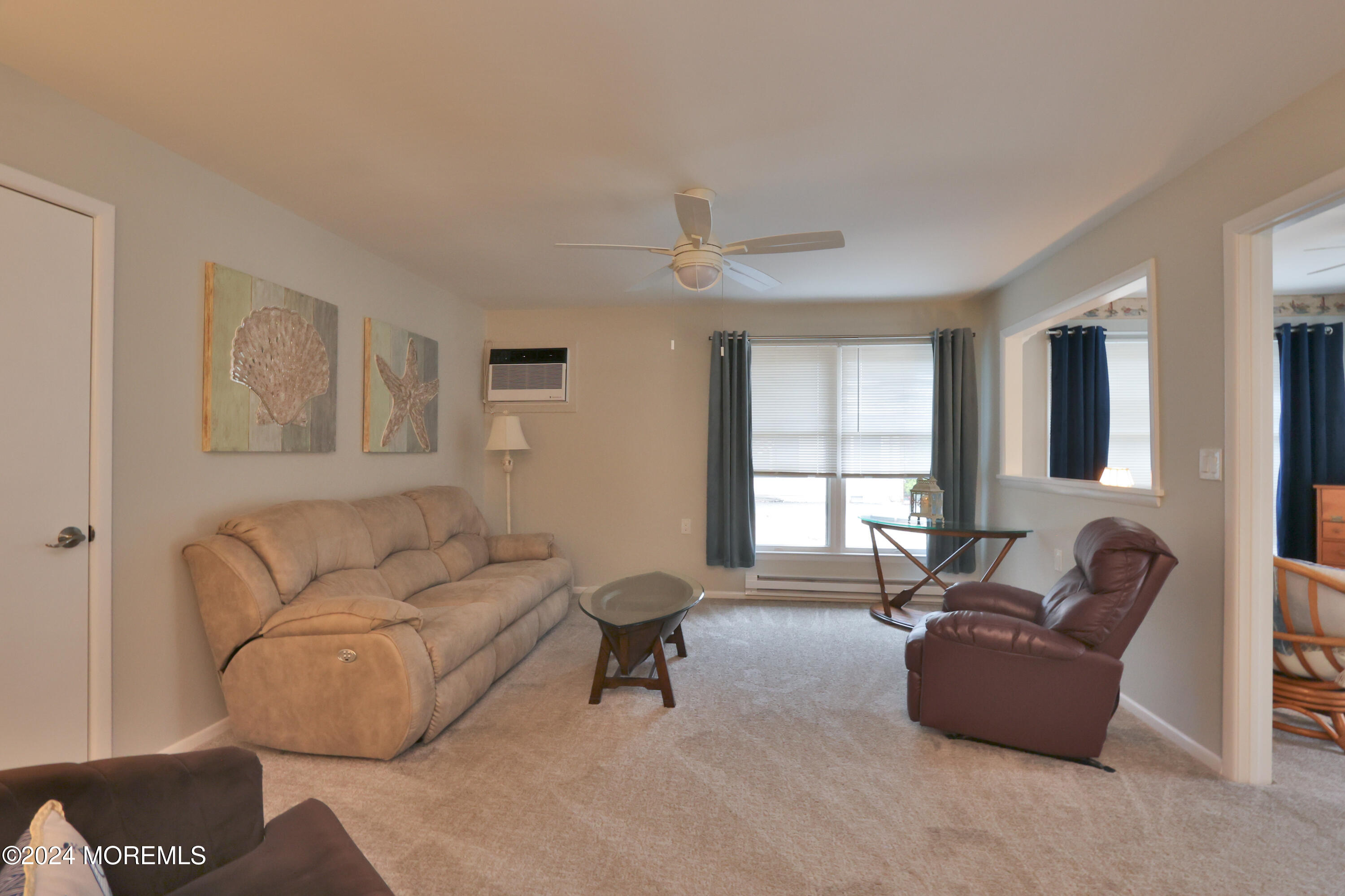 20 Cranberry Road, Unit 8 Manahawkin, NJ 08050 - Photo 8 of 42 a living room with furniture and a window