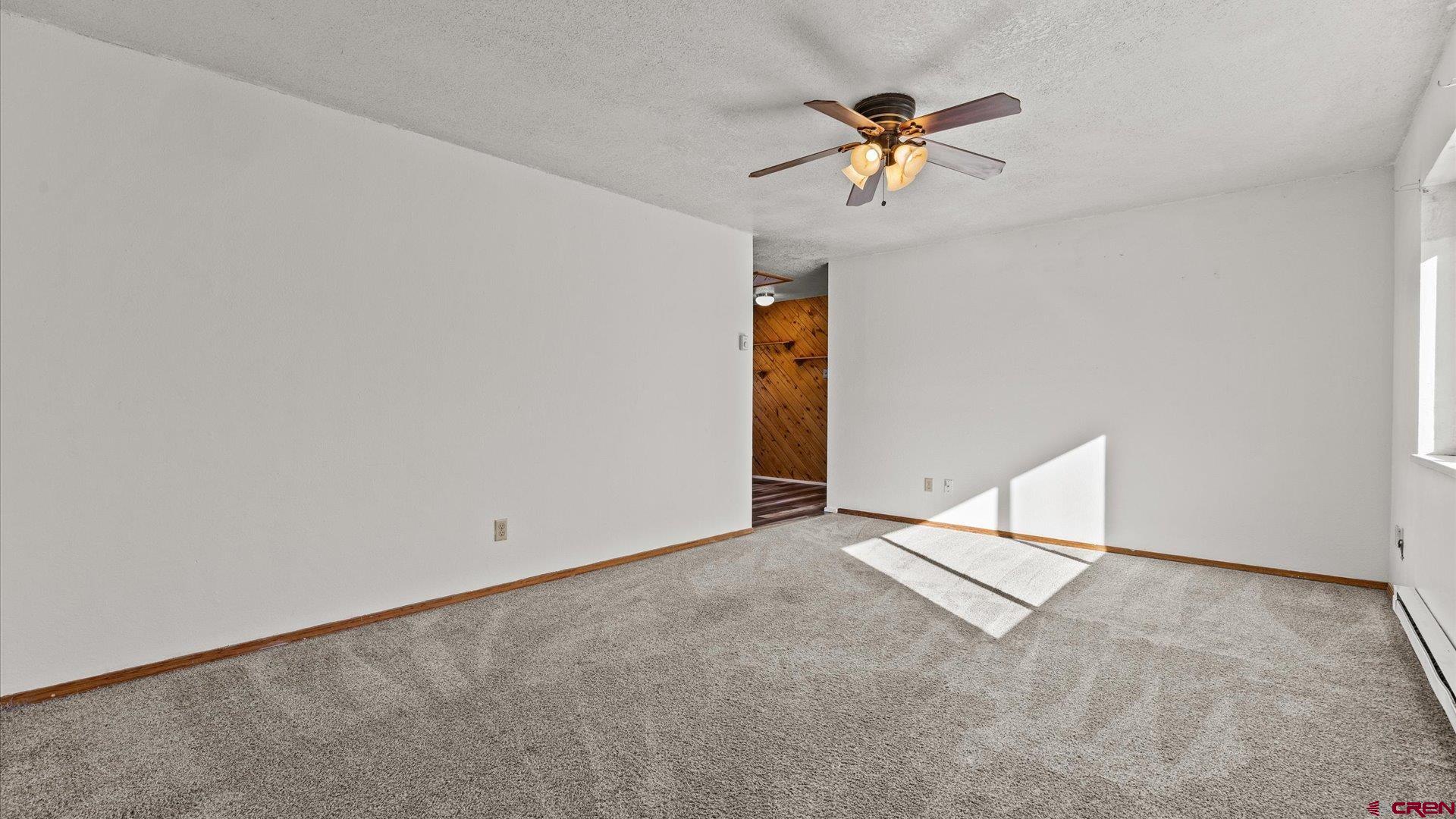 535 Labor Street Delta, CO 81416 - Photo 6 of 15 an empty room with closet and ceiling fan