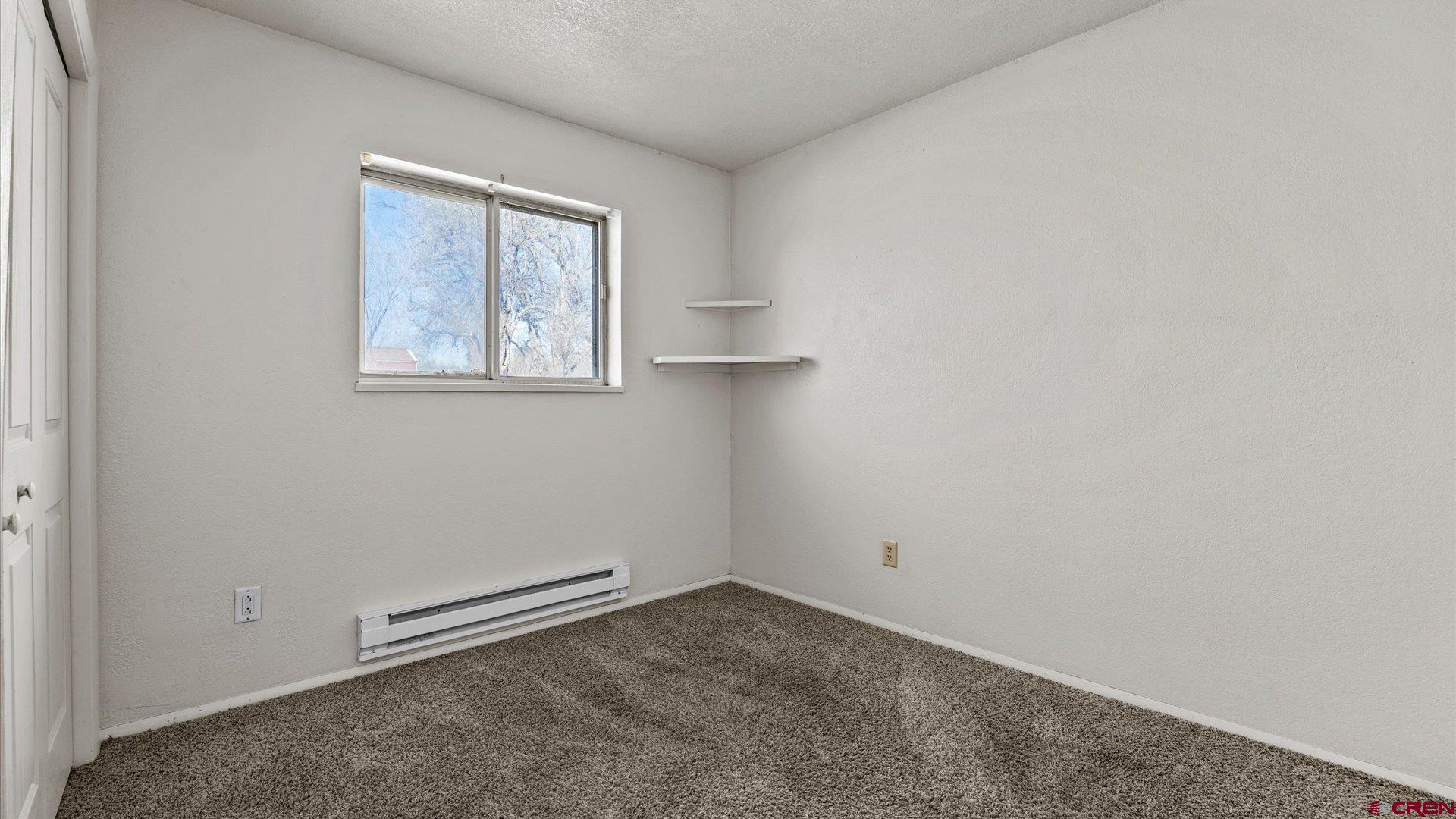 535 Labor Street Delta, CO 81416 - Photo 7 of 15 an empty room with windows