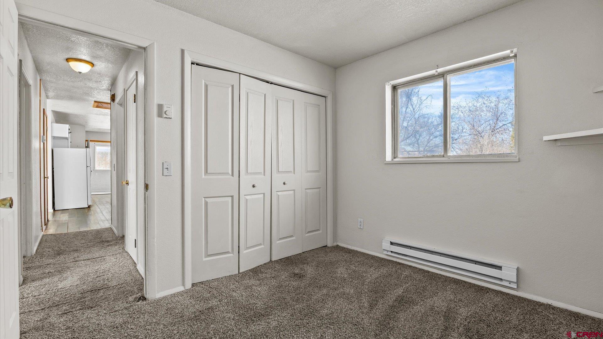 535 Labor Street Delta, CO 81416 - Photo 8 of 15 an empty room with windows and closet