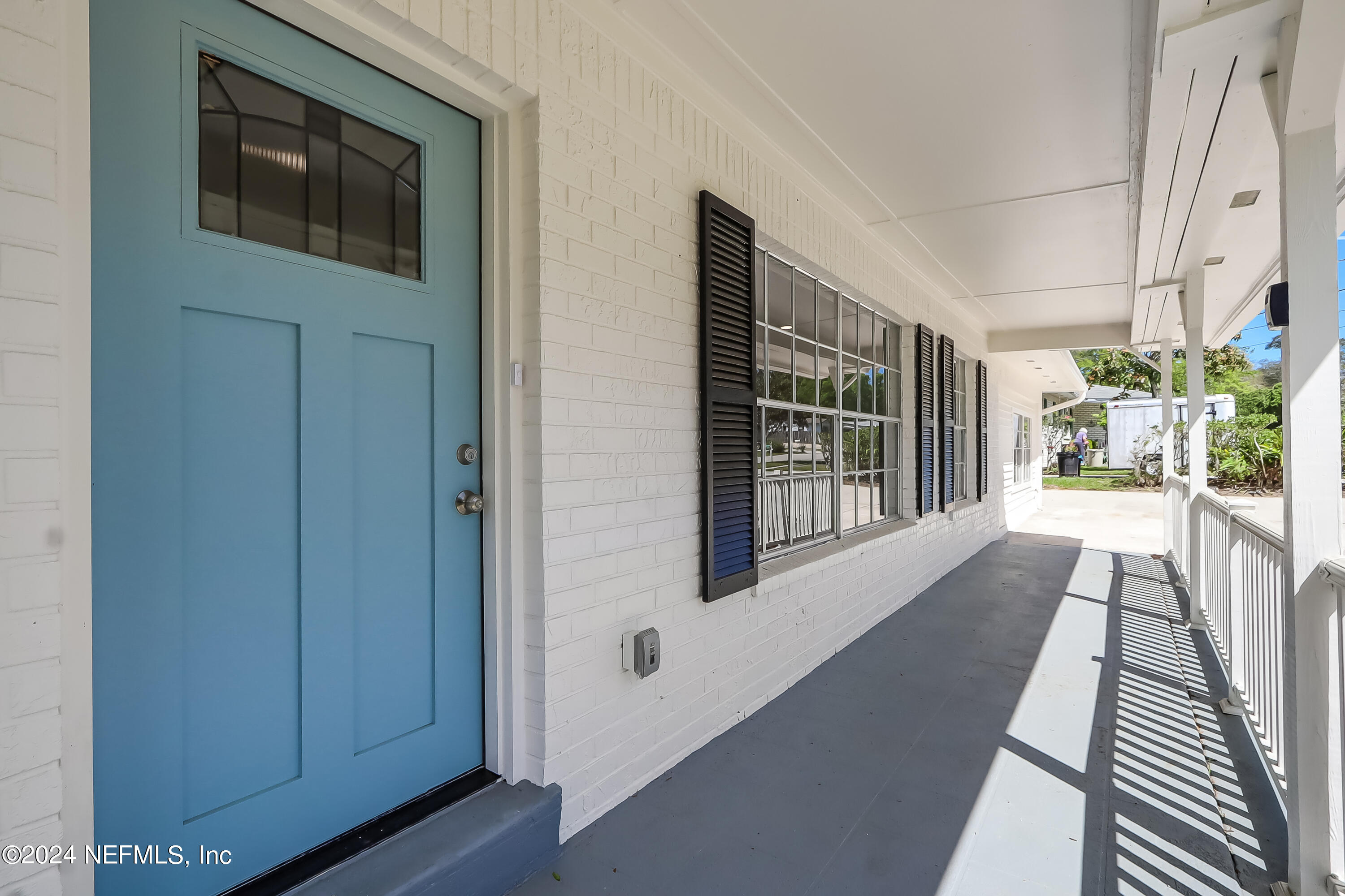 327 Neptune Road Orange Park, FL 32073 - Photo 1 of 40 a view of hallway with wooden floor and a potted plant
