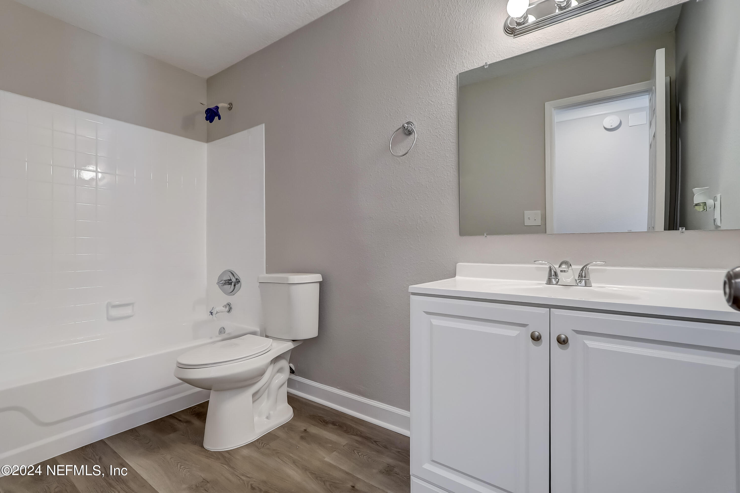 327 Neptune Road Orange Park, FL 32073 - Photo 11 of 40 a bathroom with a sink toilet and shower