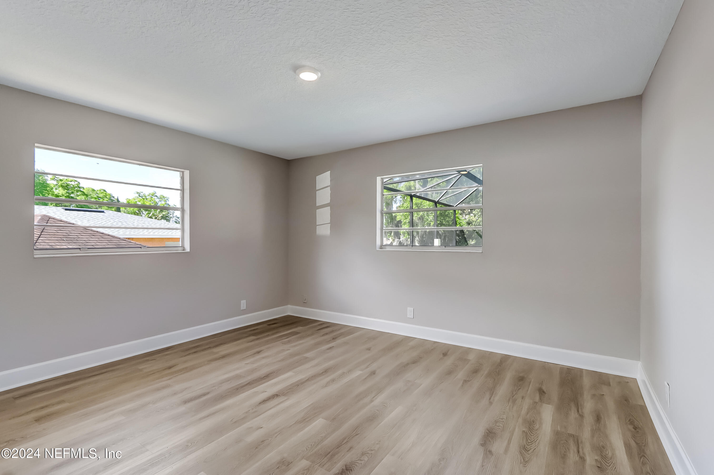 327 Neptune Road Orange Park, FL 32073 - Photo 12 of 40 an empty room with windows