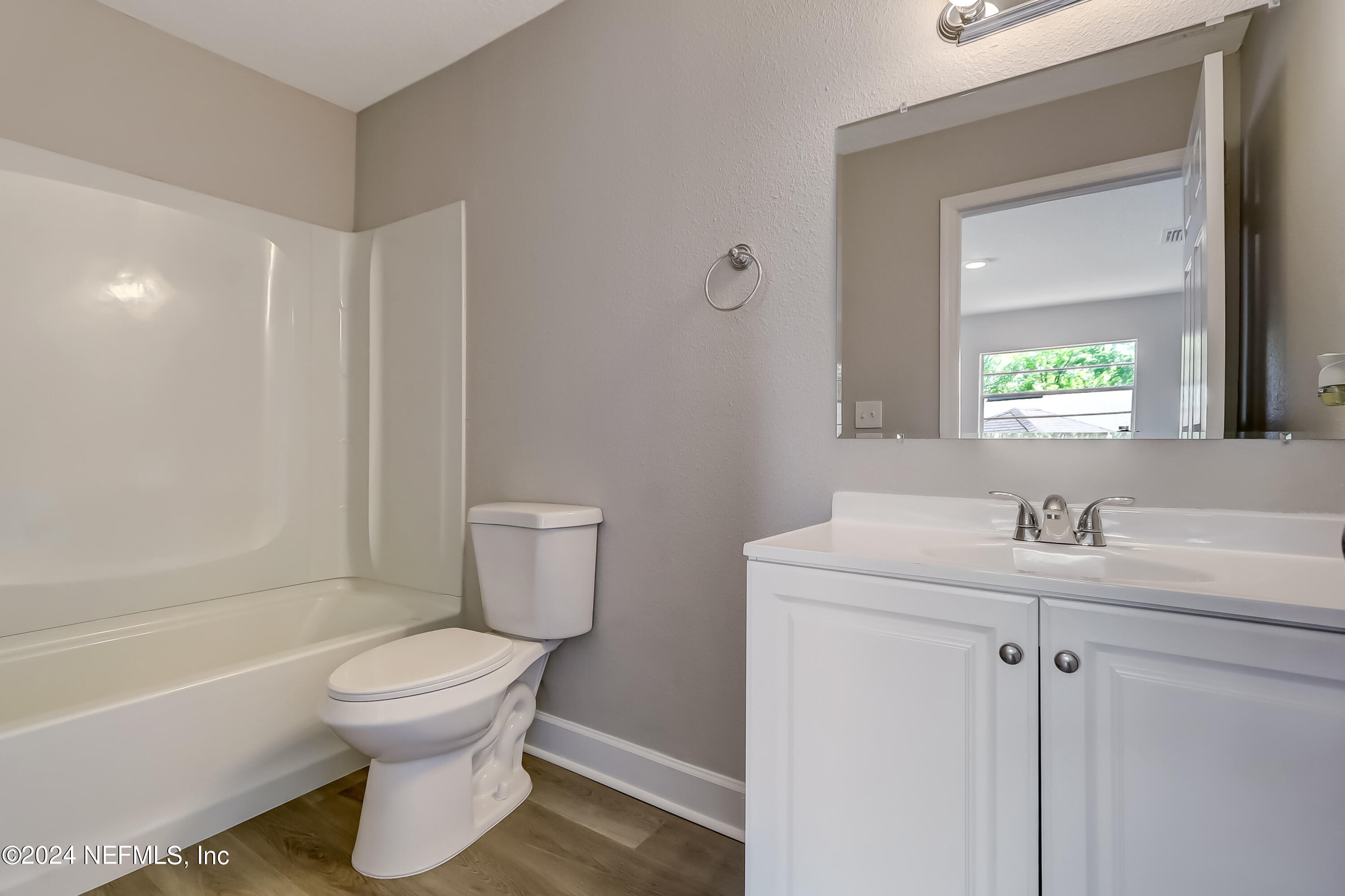 327 Neptune Road Orange Park, FL 32073 - Photo 15 of 40 a bathroom with a sink toilet and shower