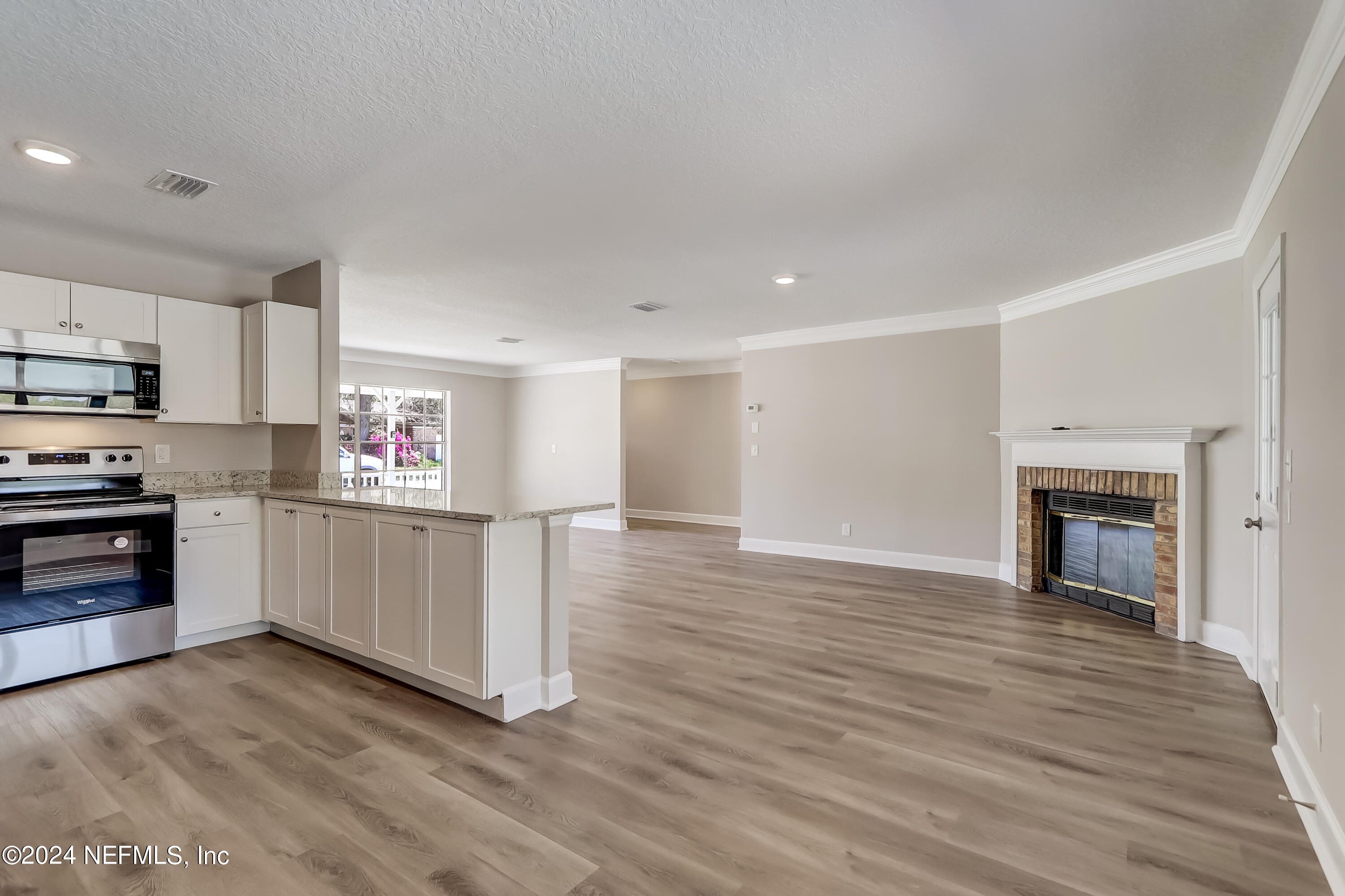 327 Neptune Road Orange Park, FL 32073 - Photo 21 of 40 a view of kitchen with wooden floor and electronic appliances