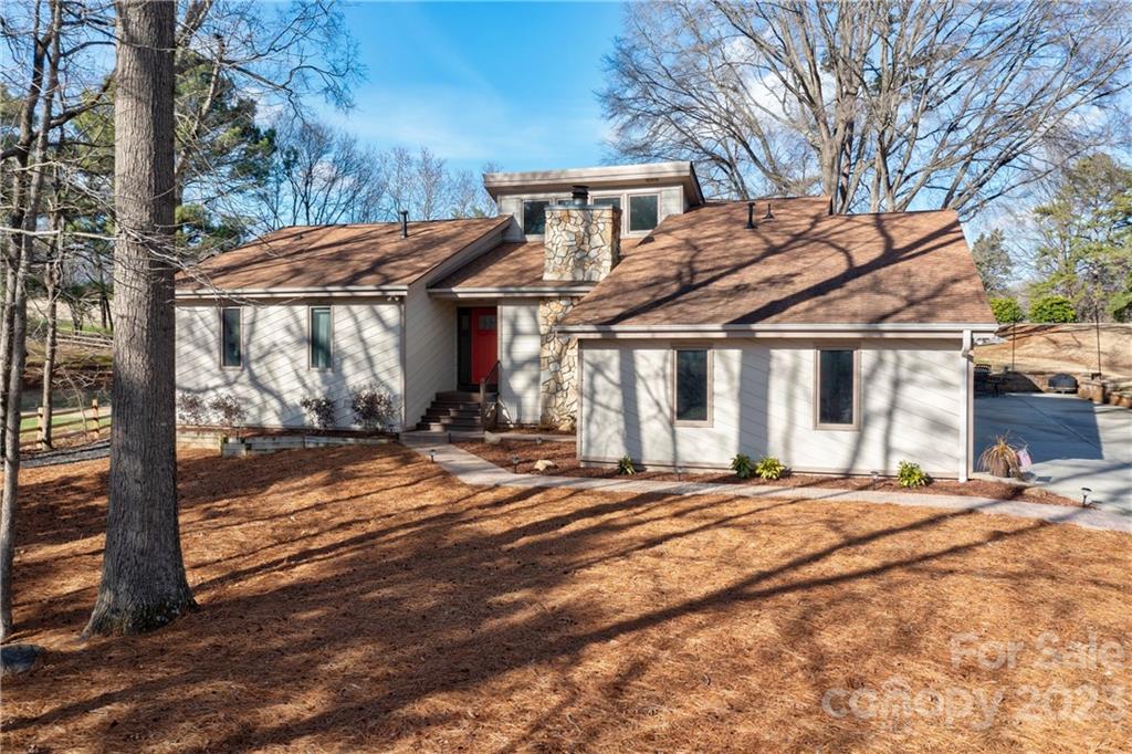3942 Rounding Run Road Charlotte, NC 28277 - Photo 1 of 29 a view of a house with a yard covered in snow