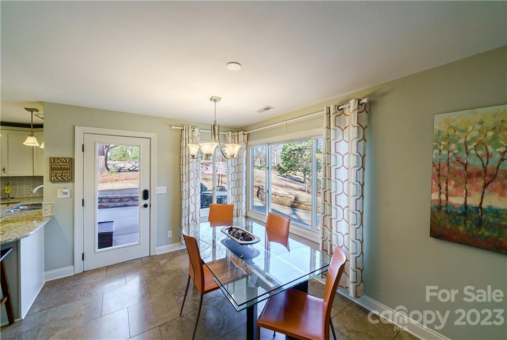 3942 Rounding Run Road Charlotte, NC 28277 - Photo 12 of 29 a view of a dining room with furniture window and wooden floor