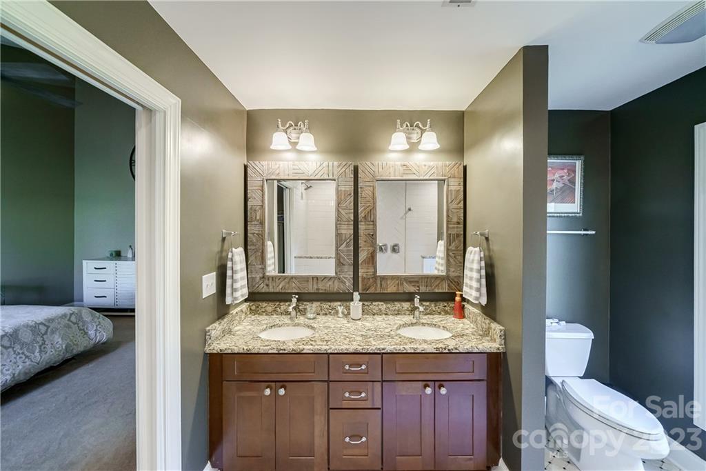 3942 Rounding Run Road Charlotte, NC 28277 - Photo 19 of 29 a bathroom with a granite countertop sink and a mirror