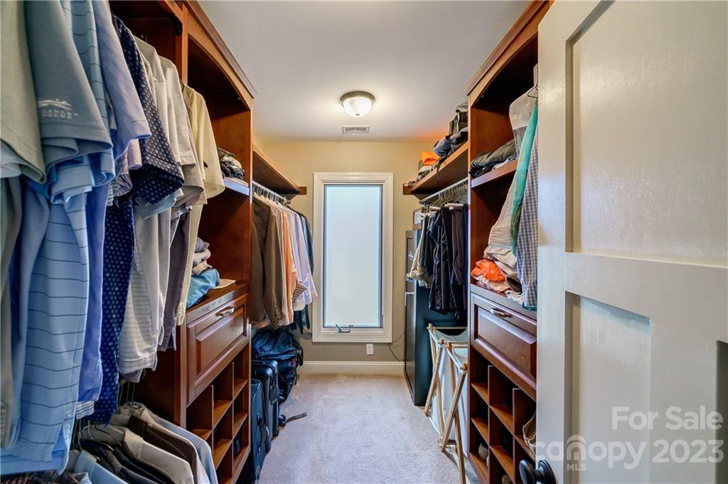 3942 Rounding Run Road Charlotte, NC 28277 - Photo 20 of 29 a view of walk in closet with clothes and shoes