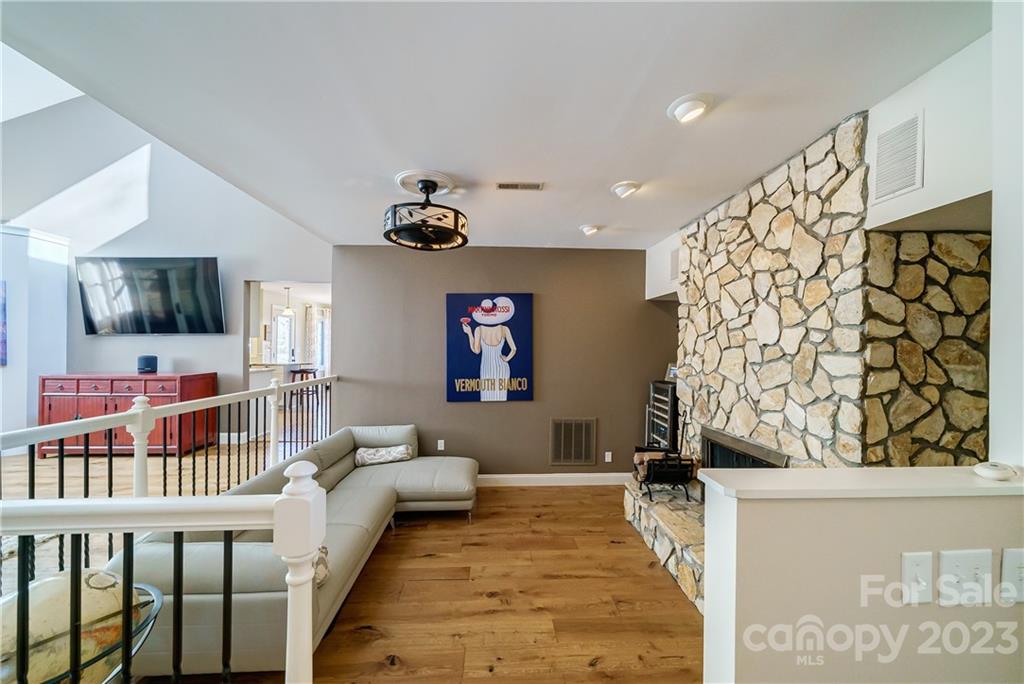 3942 Rounding Run Road Charlotte, NC 28277 - Photo 2 of 29 a living room with a couch and a flat screen tv