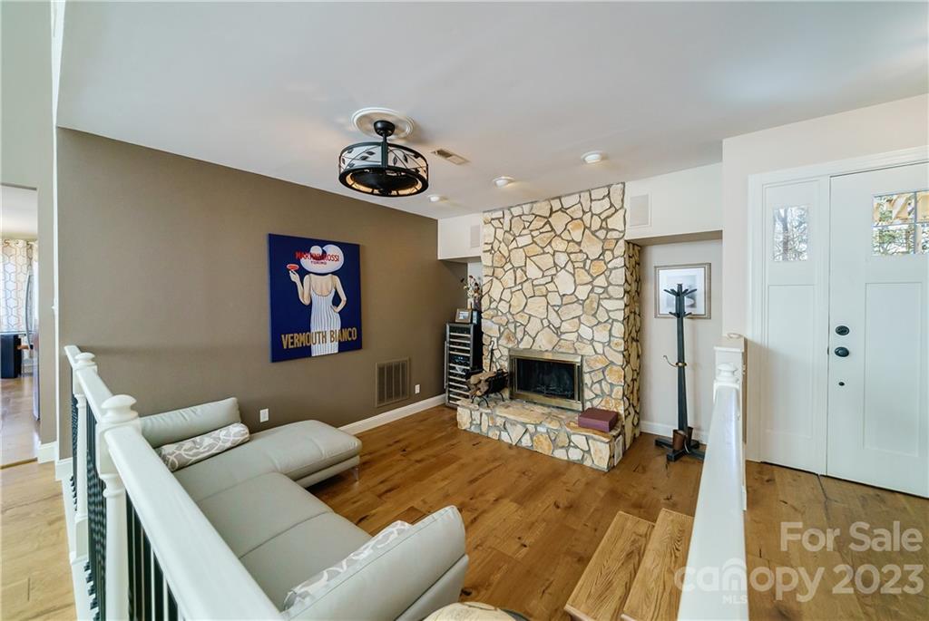 3942 Rounding Run Road Charlotte, NC 28277 - Photo 3 of 29 a living room with furniture and a fireplace