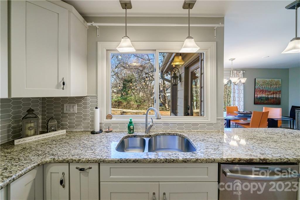 3942 Rounding Run Road Charlotte, NC 28277 - Photo 10 of 29 a kitchen with granite countertop stainless steel appliances a sink a counter space and a window