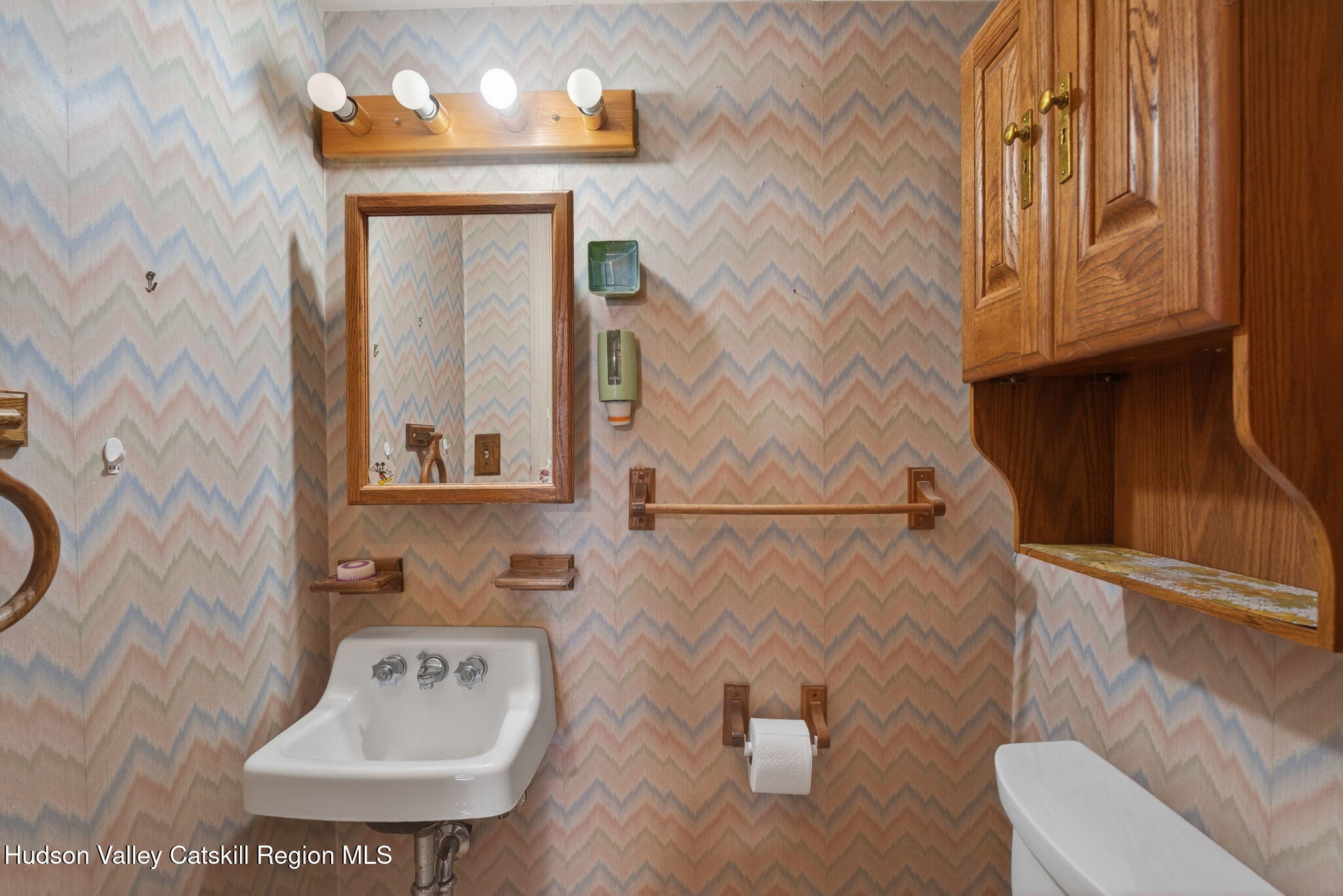 85 Harding Avenue Kingston, NY 12401 - Photo 17 of 41 a bathroom with a toilet sink and mirror