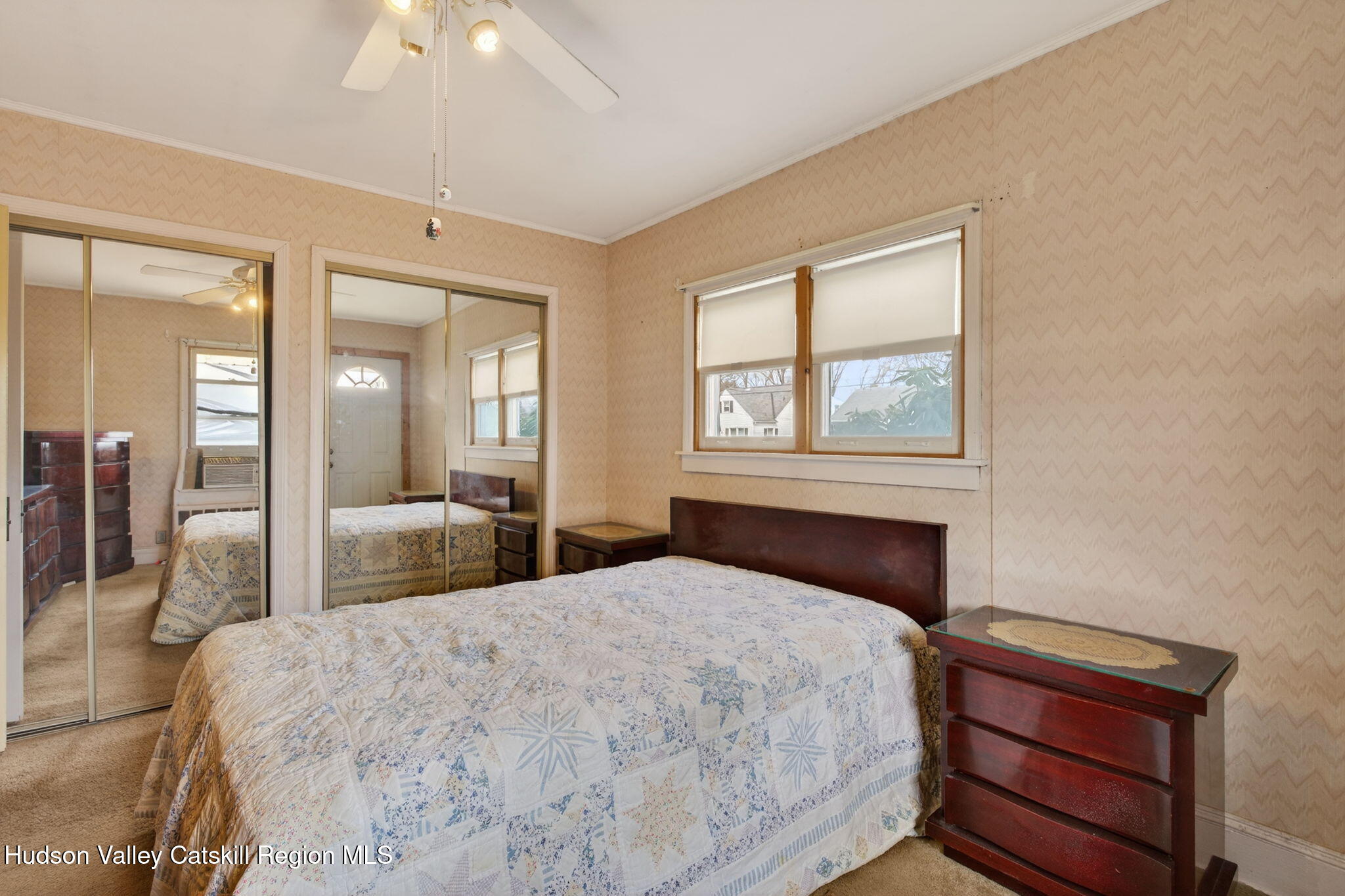 85 Harding Avenue Kingston, NY 12401 - Photo 19 of 41 a bedroom with a large bed and a chandelier