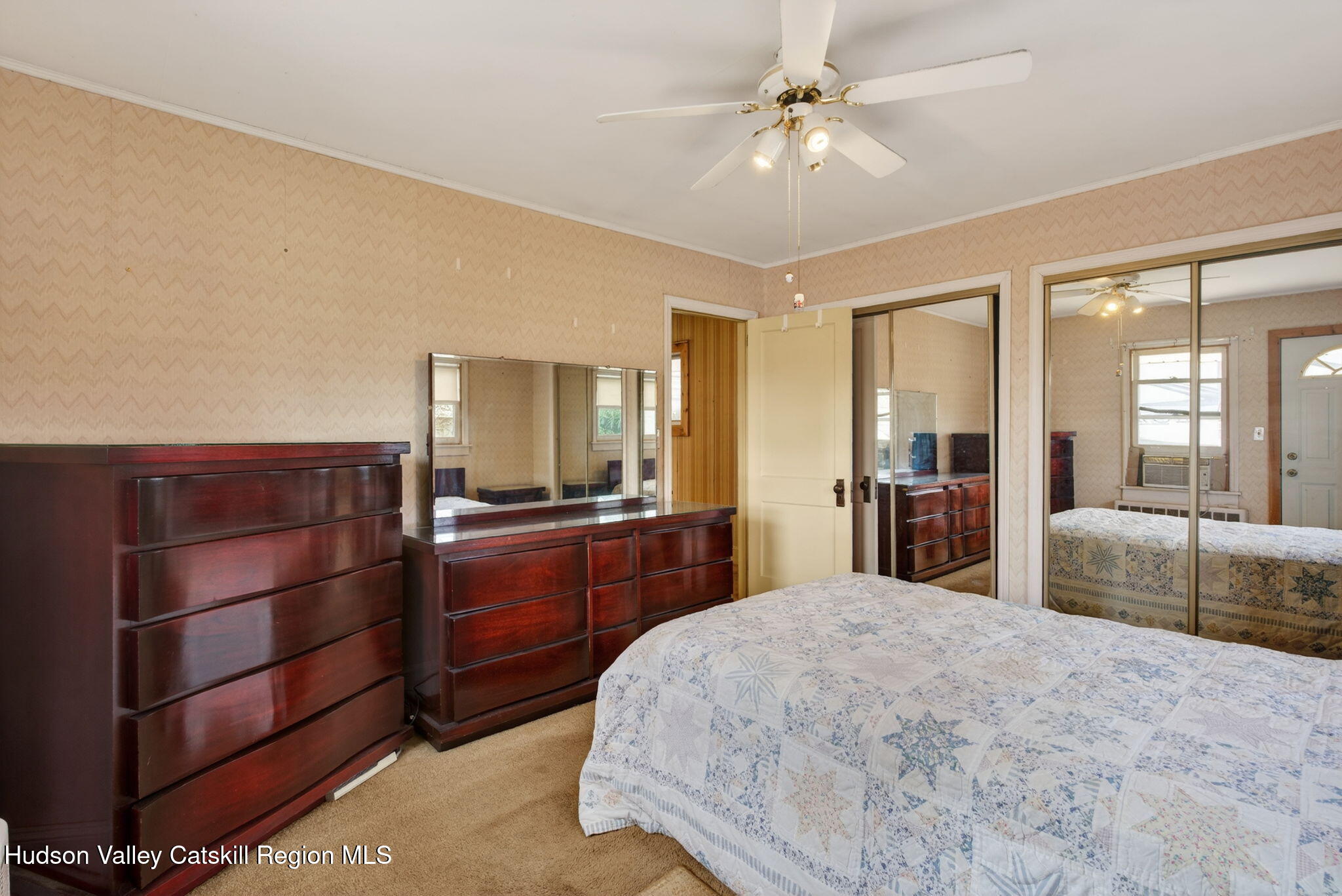 85 Harding Avenue Kingston, NY 12401 - Photo 21 of 41 a bedroom with a large bed and a chandelier