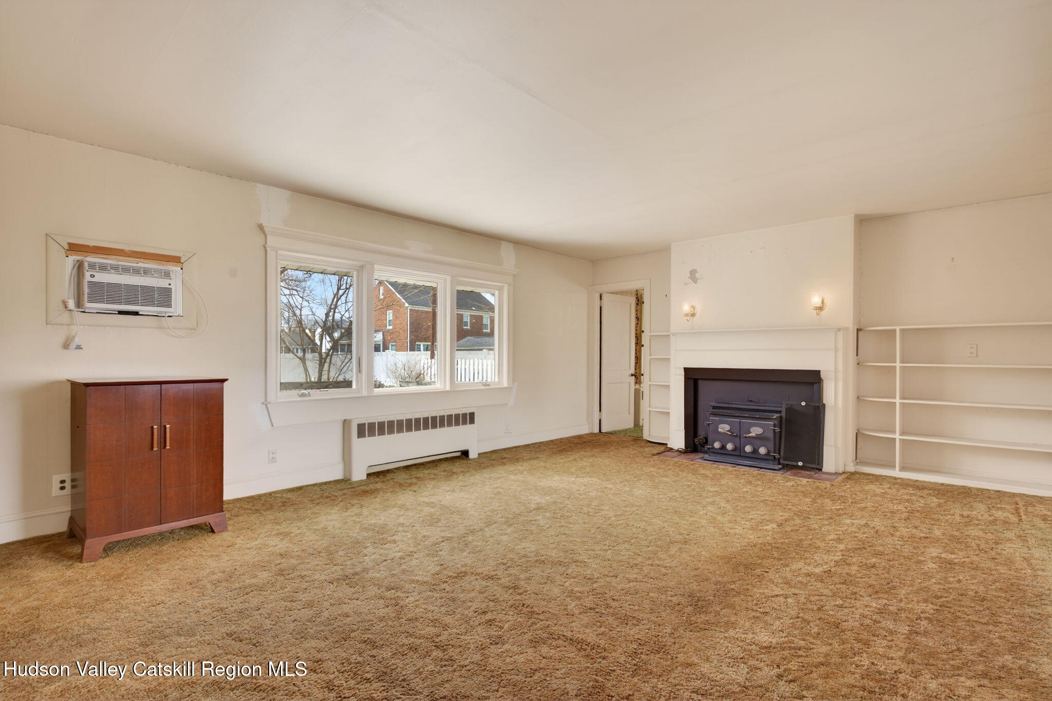 85 Harding Avenue Kingston, NY 12401 - Photo 3 of 41 an empty room with furniture and fireplace