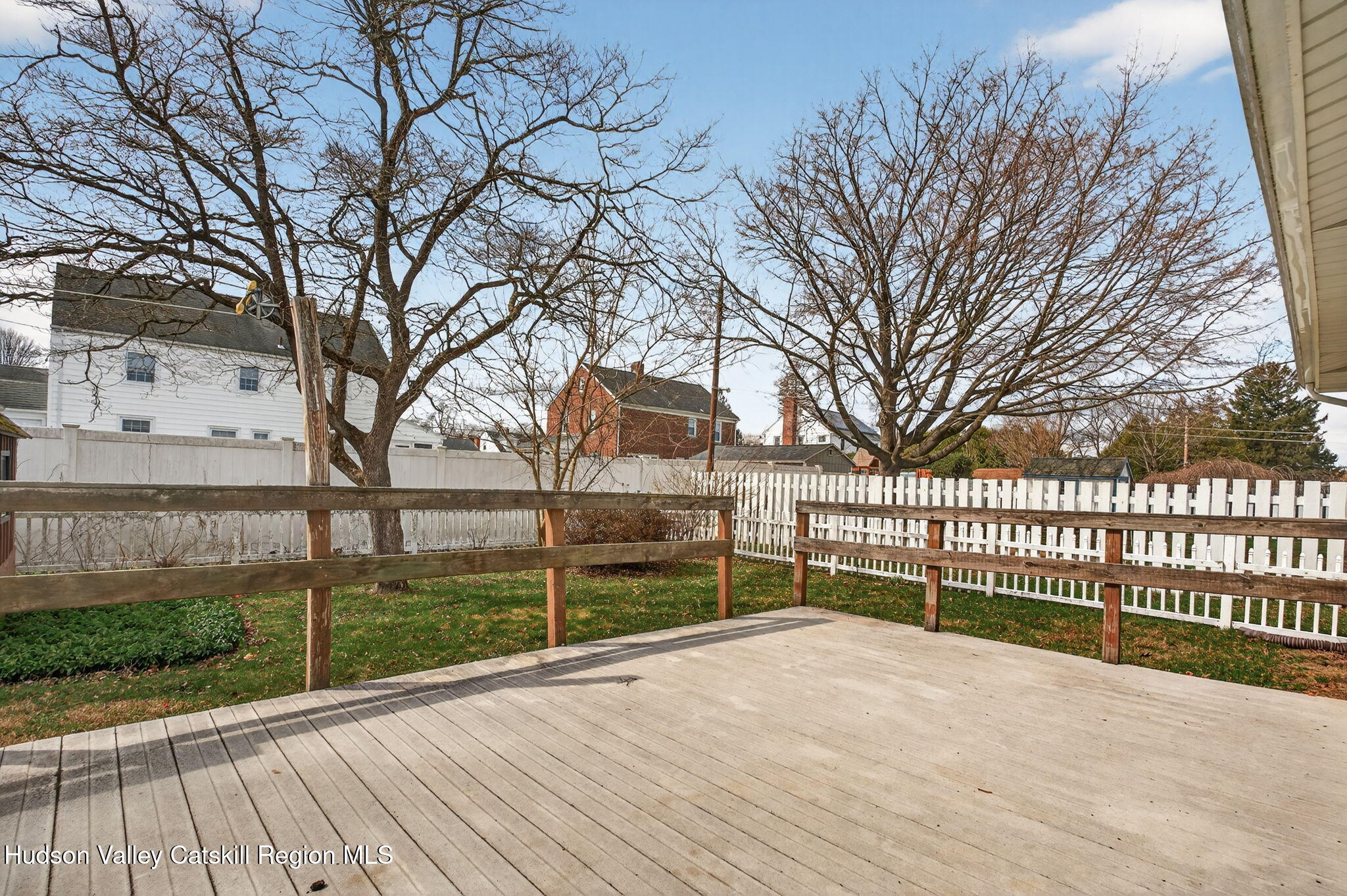 85 Harding Avenue Kingston, NY 12401 - Photo 39 of 41 a view of backyard with wooden fence and large trees