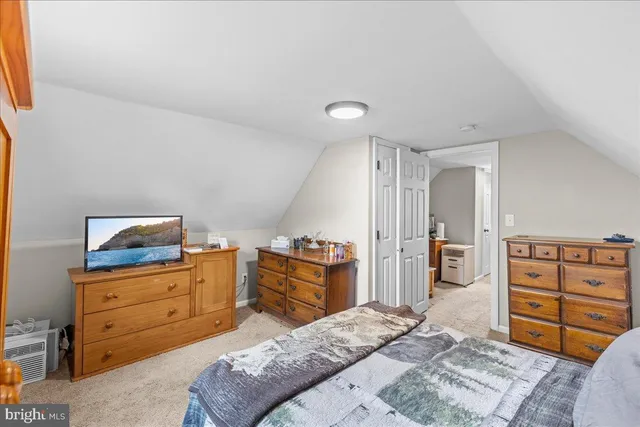 a bed room with a bed and a cabinets