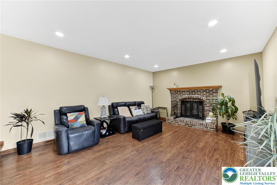 3746 Apple Road Orefield, PA 18069 - Photo 12 of 40 a living room with furniture and a fireplace