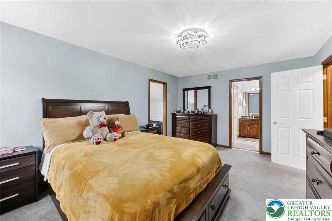 3746 Apple Road Orefield, PA 18069 - Photo 17 of 40 a bed sitting in a spacious bedroom next to a window and a bedroom