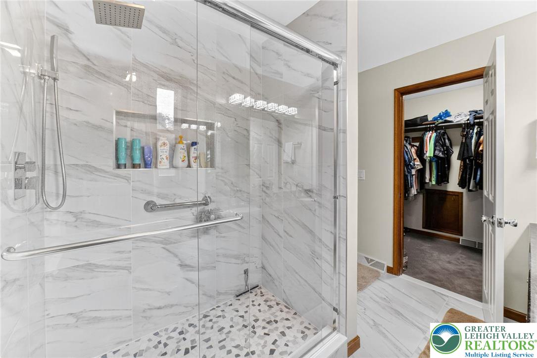 3746 Apple Road Orefield, PA 18069 - Photo 20 of 40 a bathroom with a glass shower door