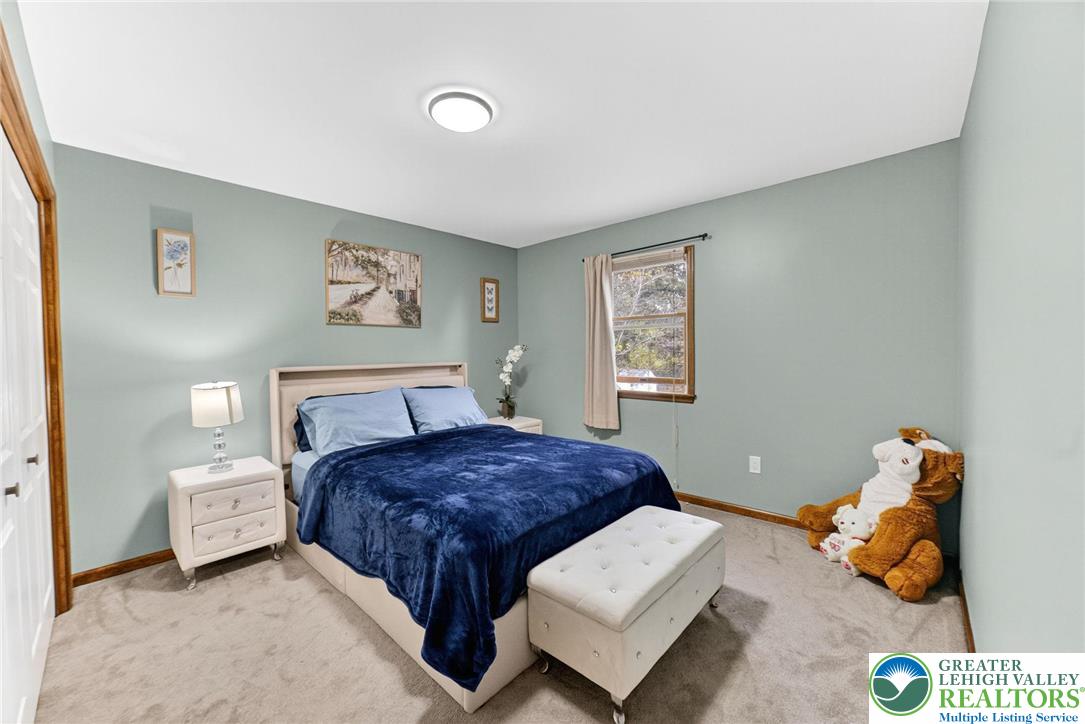 3746 Apple Road Orefield, PA 18069 - Photo 23 of 40 a bedroom with a bed and wooden floor