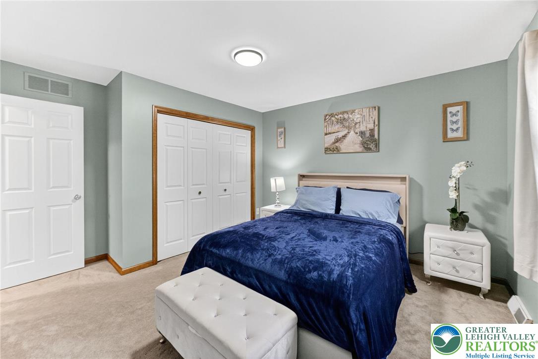 3746 Apple Road Orefield, PA 18069 - Photo 24 of 40 a bedroom with a bed and a painting on the wall
