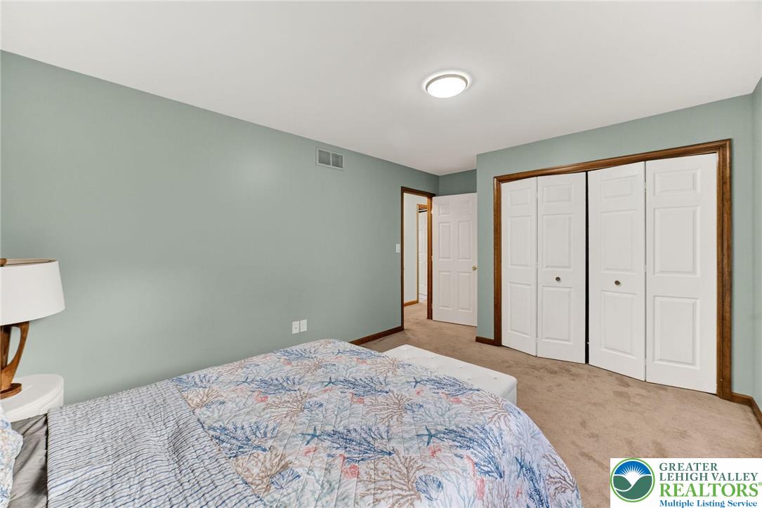 3746 Apple Road Orefield, PA 18069 - Photo 26 of 40 a bedroom with a bed and a lamp on table