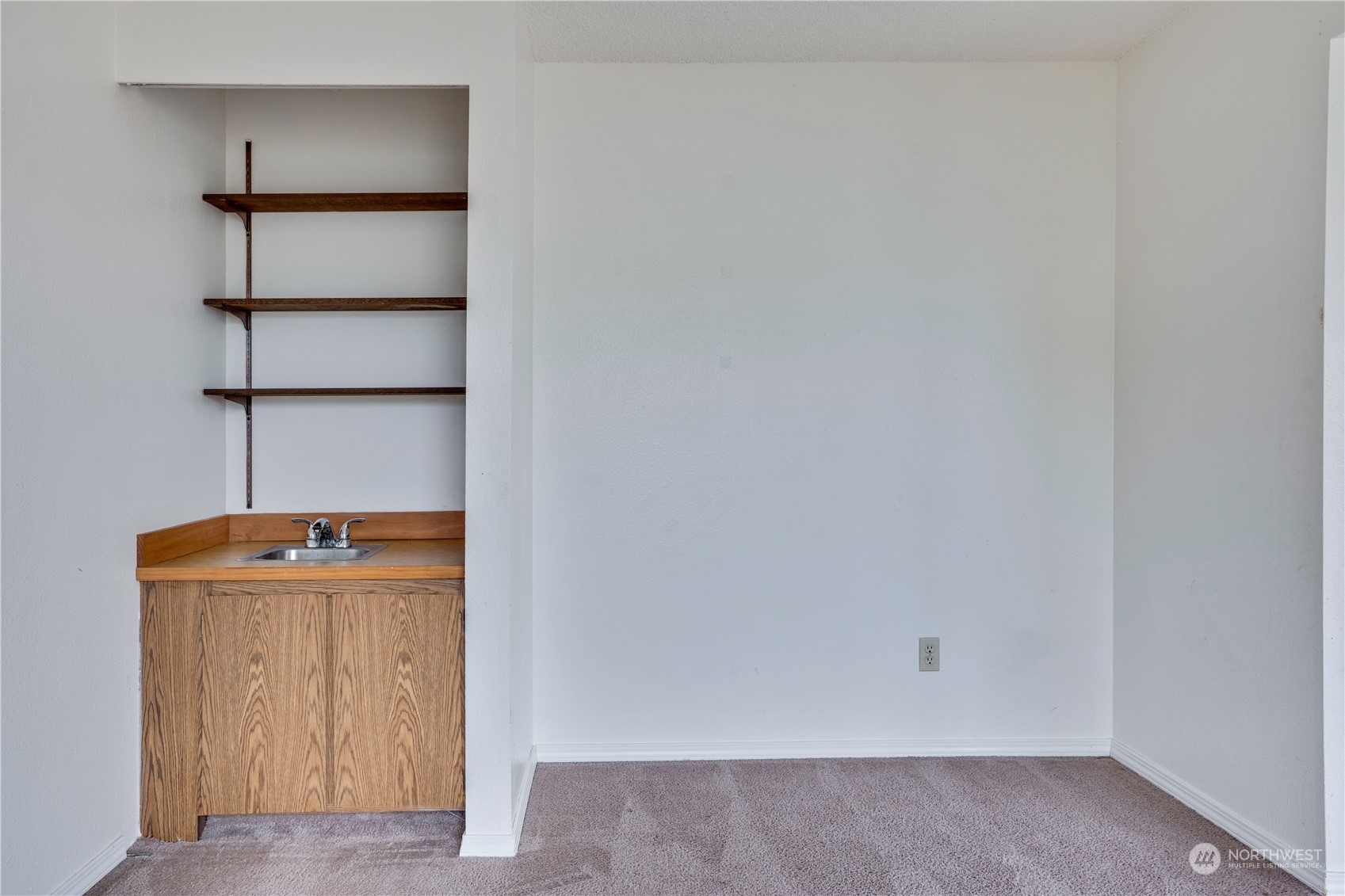 2813 Southwest 342nd Street Federal Way, WA 98023 - Photo 14 of 34 an empty room with cabinet door